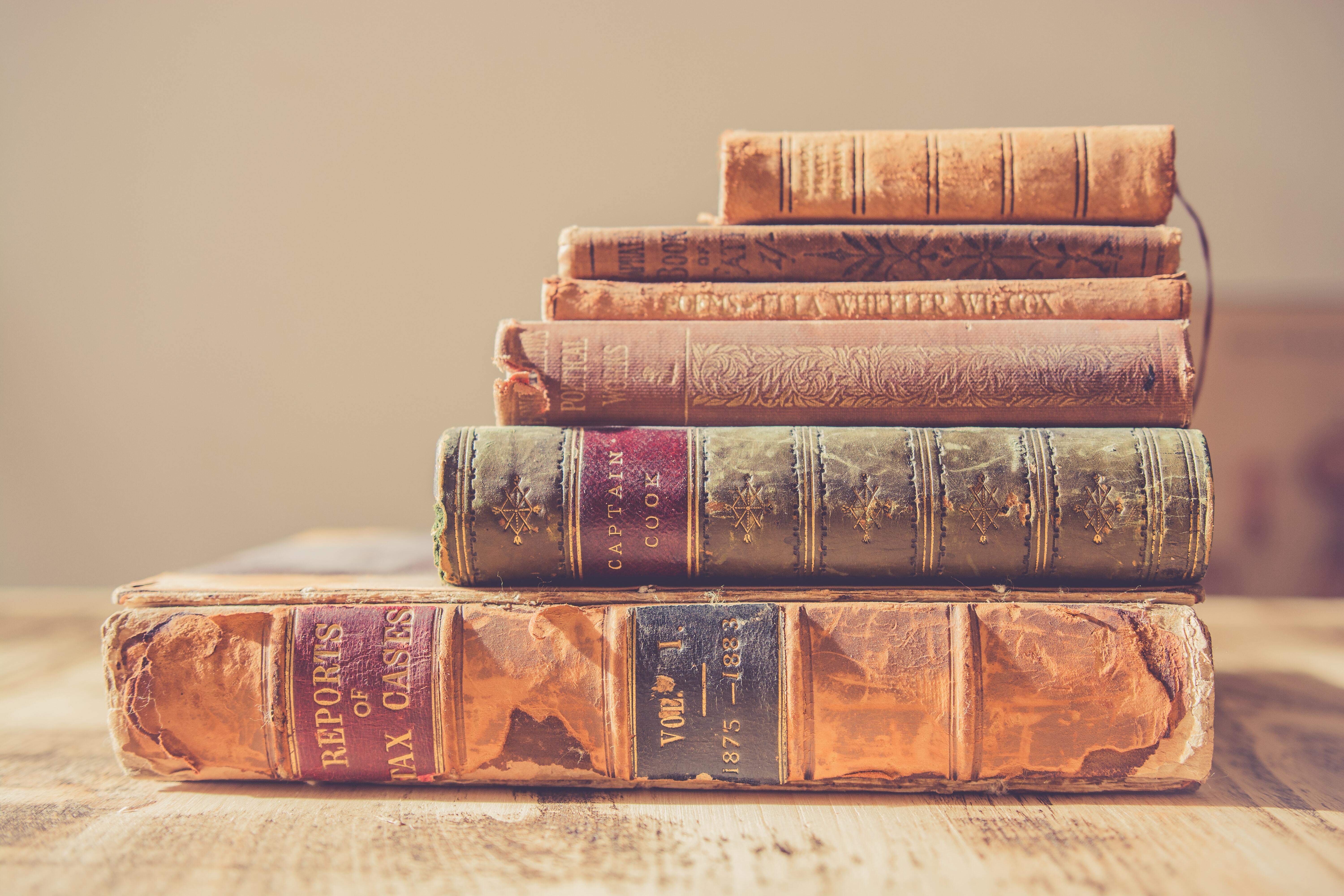 a stack of old restored books