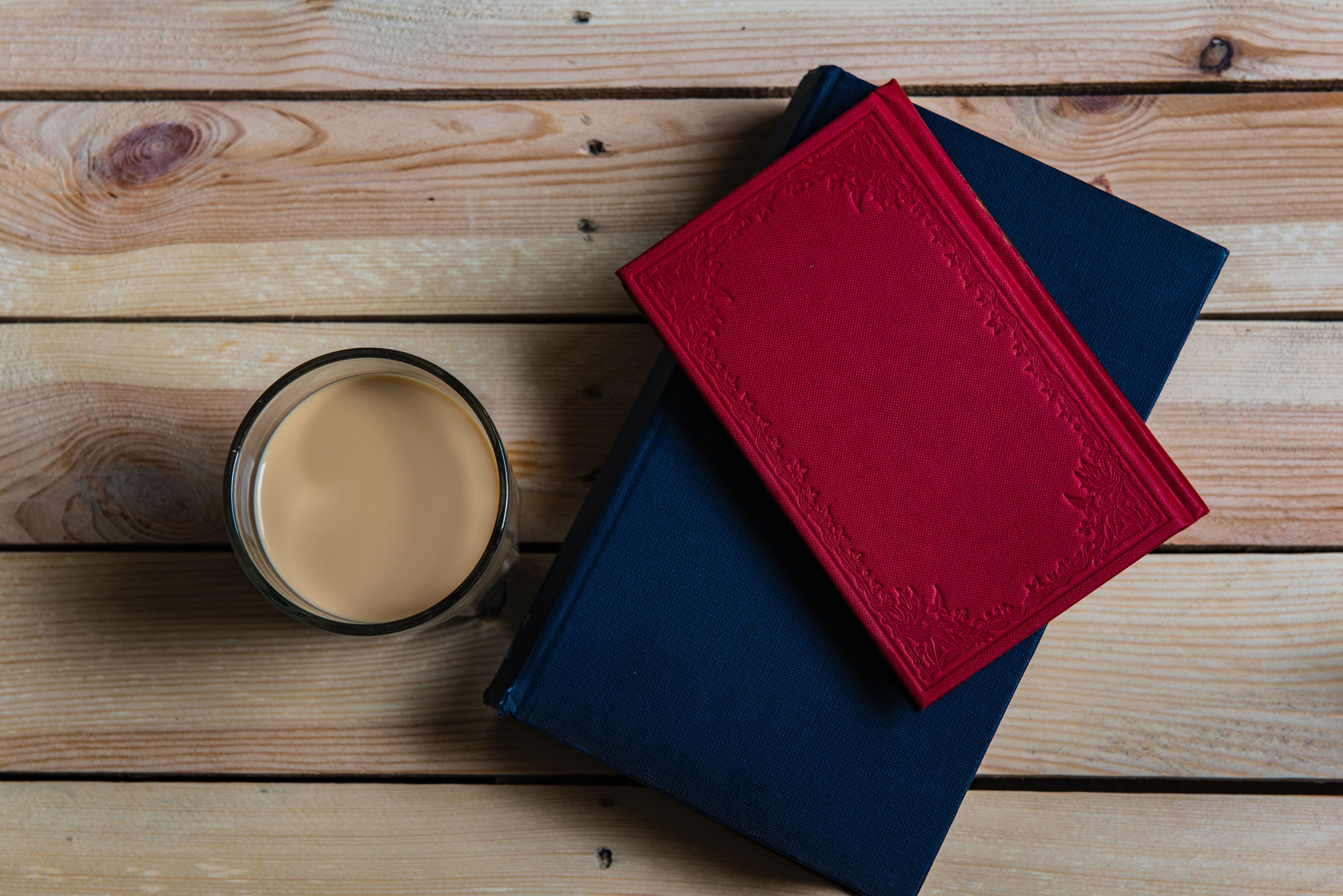 books next to a coffee cup